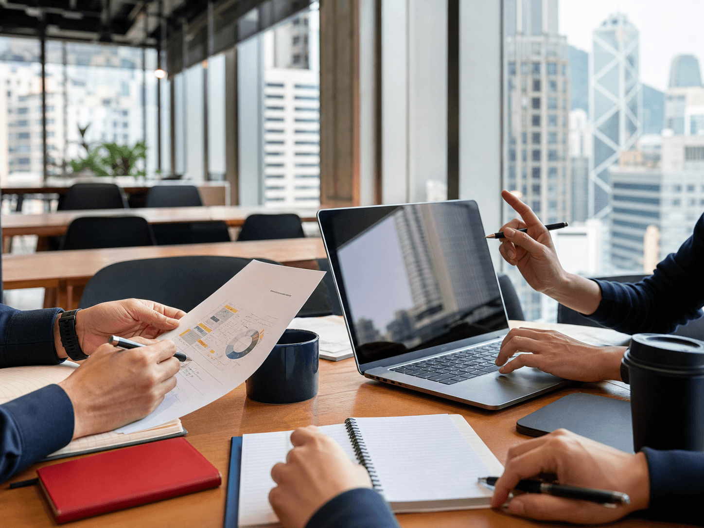 Hong Kong business professionals reviewing AI learning materials at a shared office table